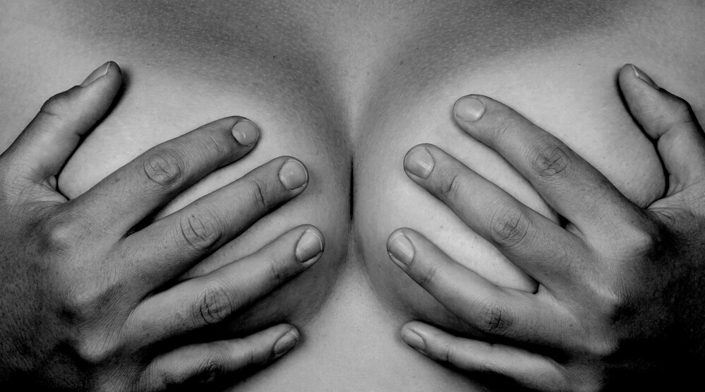 Hands Covering Breasts