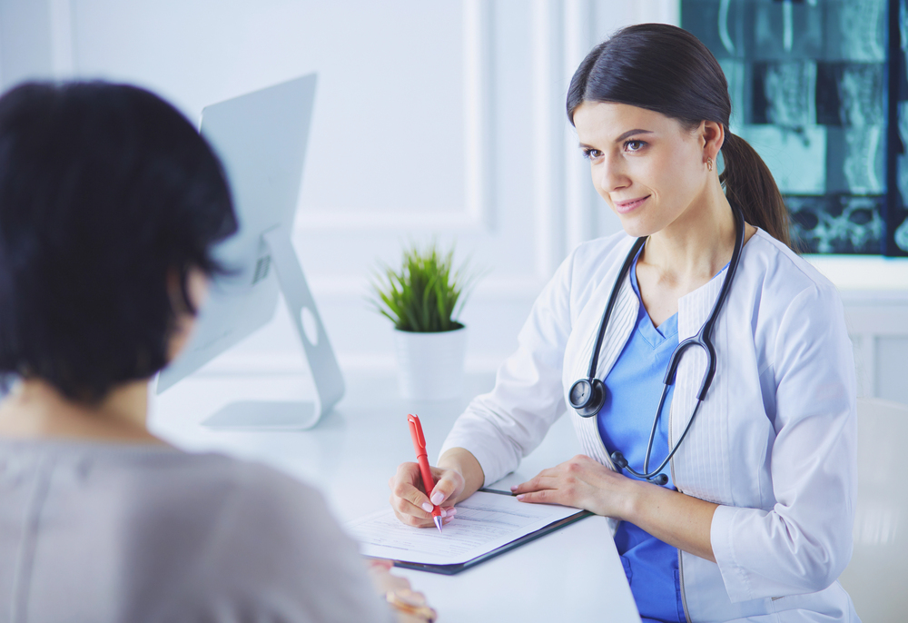 Woman Consults with a Doctor